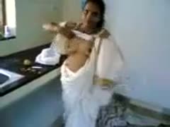In a traditional outfit, a gorgeous Indian milf girl exudes seduction.